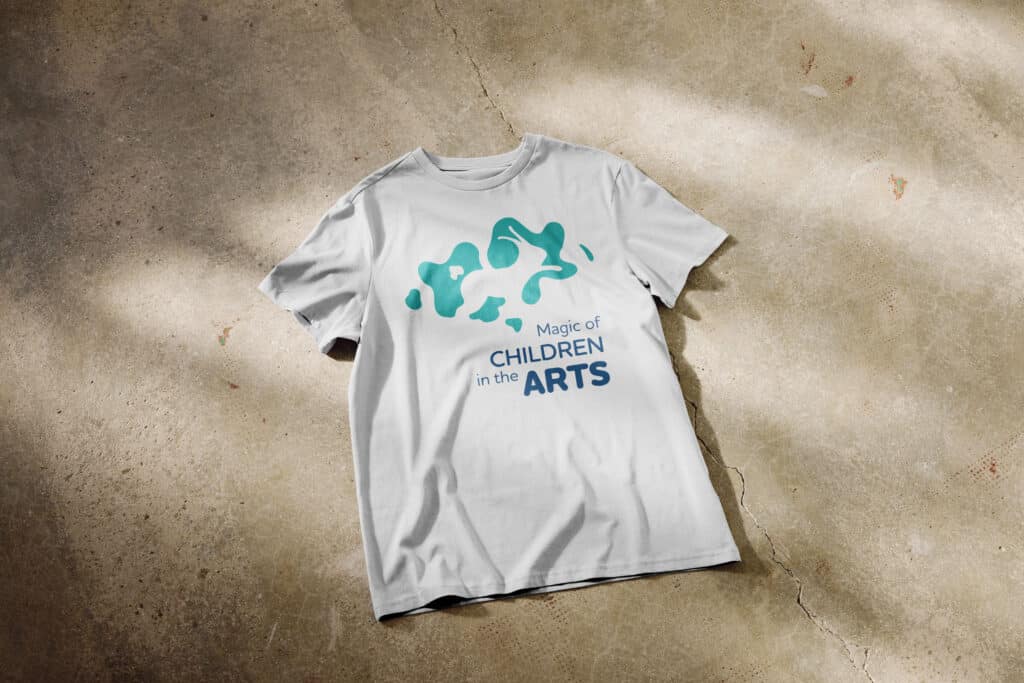 white t-shirt on floor with logo