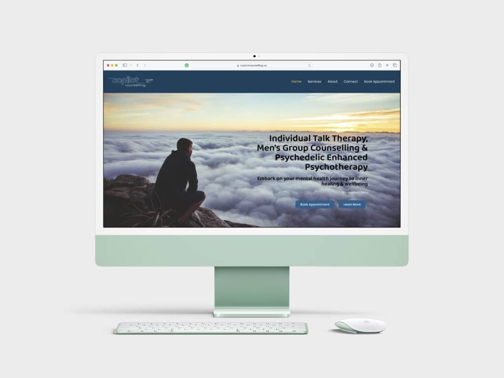 Website home page displayed on a green iMac on a light grey background